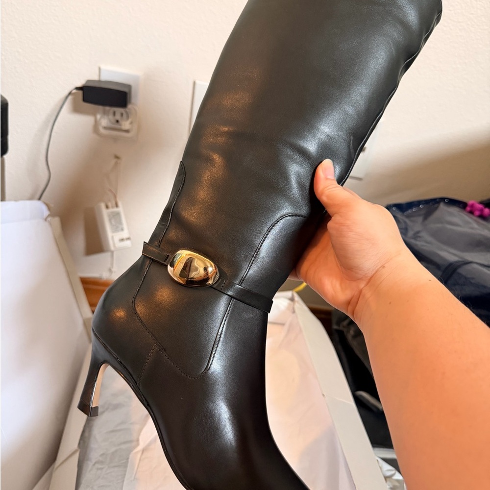 Chic Black Leather Heeled Boots with Gold Accent